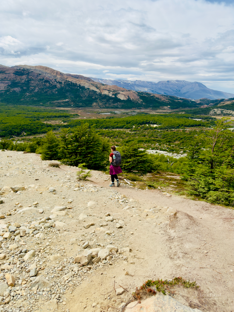 Hiker descending the Laguna de los Tres Trail in Los Glaciares National Park near El Chaltén, Patagonia, Argentina.