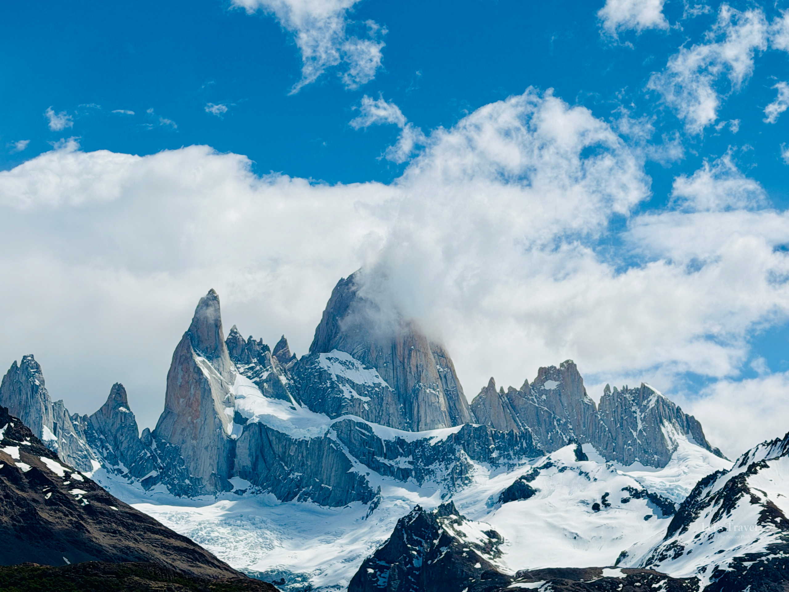 Mount Fitz Roy partially covered by clouds in Los Glaciares National Park near El Chaltén, Patagonia, Argentina.
