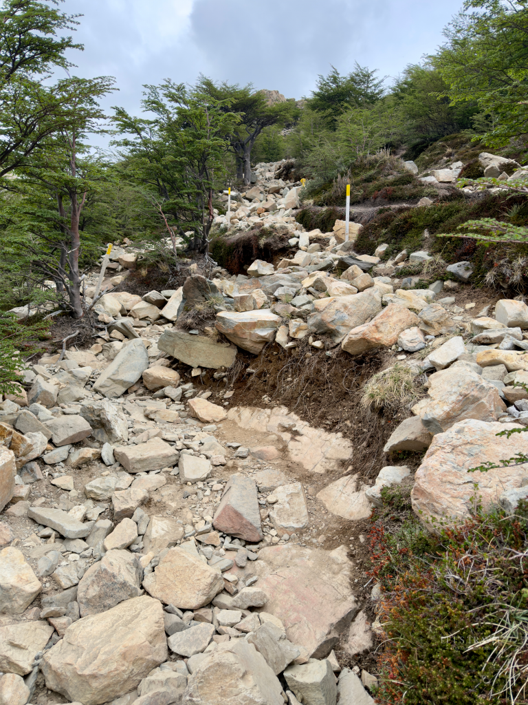 Rocky hiking trail through a boulder field on the Base Torres hike in Torres del Paine National Park, Chilean Patagonia.