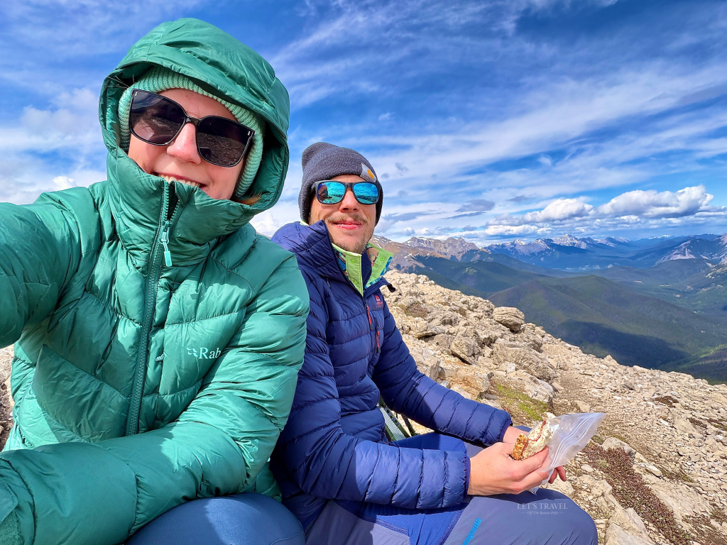 Two hikers enjoying the summit of the Sulphur Skyline Trail in Jasper National Park, Alberta, Canada.