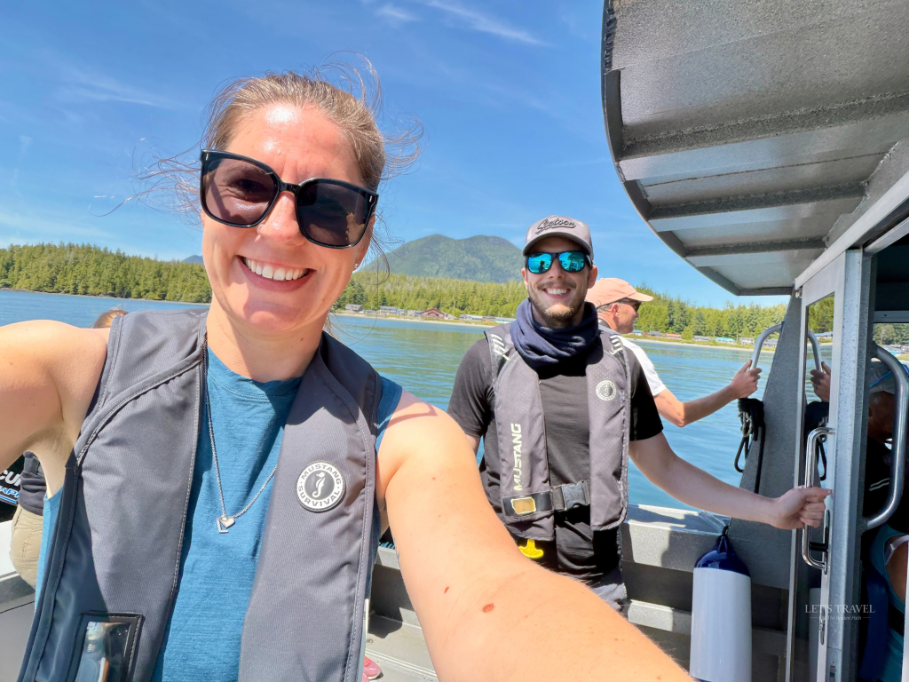 Whale watching tour in Tofino on Vancouver Island with two travelers on a boat in Clayoquot Sound.