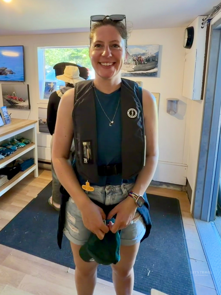Woman preparing for a sea otter watching tour in Tofino on Vancouver Island, Canada.